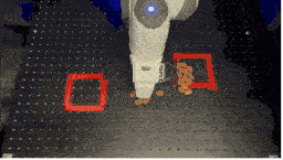 A gif showing a robot separating granular media into two piles.